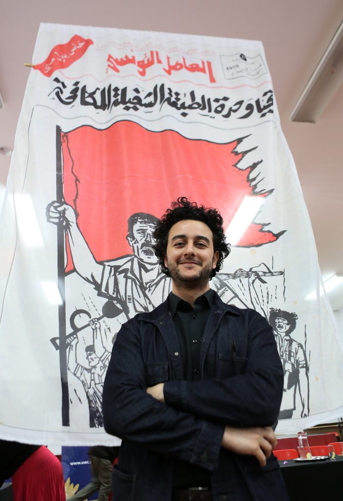 Photo of Idriss Jebari with cover of Perspectives Tunisiennes. 